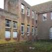 View.  Part of central area of Sandhurst Barrack Block showing access hatches and metal framed windows.