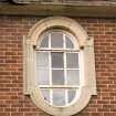 Detail.  Oval window with stone surround on S elevation of main Sandhurst Barrack Block.