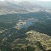 General oblique aerial view of Loch Laggan centred on the dam with the farmstead in the distance, taken from the SSW.