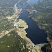 General oblique aerial view of Loch Laggan centred on the dam with the farmstead adjacent, taken from the WSW.