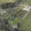 Oblique aerial view centred on the country house and walled gardens, taken from the NNE.