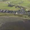 Oblique aerial view centred on the whisky distillery, taken from the NE.