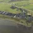 Oblique aerial view centred on the whisky distillery, taken from the NE.