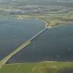 Oblique aerial view centred on the road bridge, taken from the SE.