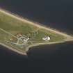 Oblique aerial view centred on Chanonry Point Lighthouse, cottages and ferry house, taken from the S.