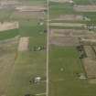 General oblique aerial view of the village centred on the pattern of dispersed buildings and layout of regular fields, taken from the WSW.