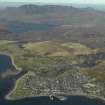 General oblique aerial view centred on the town with Ben More Coigach in the distance, taken from the SE.