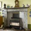 Interior. Sample flat, detail of sitting room mantlepiece and fireplace showing grey marble.
