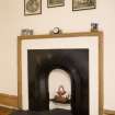 Interior. Sample flat, detaill showing bedroom cast iron fireplav=ce with wooden mantlepiece.