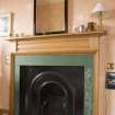 Interior. Sample flat, detail of bedroom (former dining room) cast iron mantlepiece with wooden mantlepiece.