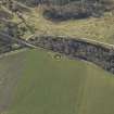 Oblique aerial view centred on the remains of the henge, taken from the N.