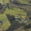Oblique aerial view centred on the country house and walled garden, taken from the NW.