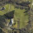 Oblique aerial view centred on the country house and walled garden, taken from the SSW.