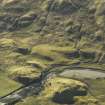 Oblique aerial view centred on the remains of the township and potato damps, taken from the NW.