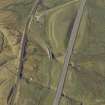 Oblique aerial view centred on the road bridge and the remains of the old road, taken from the NE.