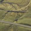 Oblique aerial view centred on the road bridge and the remains of the old road, taken from the NW.