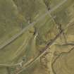 Oblique aerial view centred on the road bridge and the remains of the old road, taken from the SW.