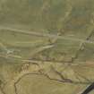 Oblique aerial view centred on the road bridge and the remains of the old road, taken from the SE.