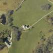 Oblique aerial view centred on the country house, cottage and farmsteading, taken from the SE.