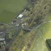 Oblique aerial view centred on railway station, taken from the NW.