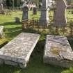 Detail.  Showing table gravestones from NE.