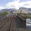 View.  From NW showing railway swing bridge and new signal box looking along railway with Ben Nevis in the background.