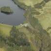 Oblique aerial view centred on the reservoir, dam and cottage, taken from the SE.