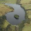 Oblique aerial view centred on the reservoir, dam and cottage, taken from the SW.