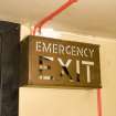 Interior. 3rd floor. Back stair. Emergency escape sign.