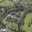 Oblique aerial view centred on Stirling University halls of residence with the church adjacent, taken from the NW.