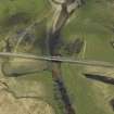 Oblique aerial view centred on the road bridge, taken from the WNW.