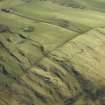 Oblique aerial view centred on the remains of the fort, taken from the NW.