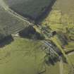 Oblique aerial view centred on Steele Road station and road overbridge, taken from the NE.