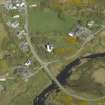 Oblique aerial view centred on the church with the hotel adjacent, taken from the SW.