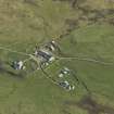 Oblique aerial view centred on the farmstead and house, taken from the NW.
