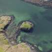 Oblique aerial view centred on the remains of the island dwelling, taken from the E.