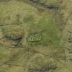 Oblique aerial view centred on the remains of the burial-ground, taken from the E.