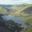 General oblique aerial view looking along Glen Finglas with the dam and power station in the foreground, taken from the SSW.