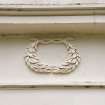 S elevation. Typical decorative wreath. Detail