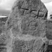 Upper Manbean Pictish symbol stone. View of reverse showing carved initials (B&W)