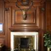 Interior. Detail of fireplace and chimney breast in boardroom on first floor.