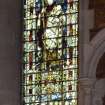 Interior. View of nave stained glass window  by Charles E Kempe