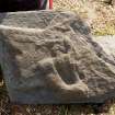 Fragment of west highland grave slab - tunic and sword