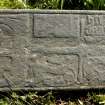 Fragment of west highland grave slab showing galley, hilt of sword and decoration