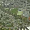 Oblique aerial view centred on administration block next to stadium, taken from the N.