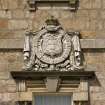Detail of armorial panel above entrance doorway on SE facade