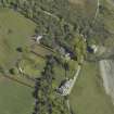 Oblique aerial view centred on the towerhouse, country house, walled garden and farmsteading, taken from the WNW.