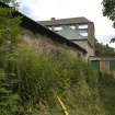 View looking NW. Original Balerno Mill buildings (left), currently the Pig Store and Dry Store and the covered Tanyard (green doors) beyond.