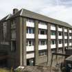 View of main block looking NE. Little of the original louvering survives except on the N elevation to the left of the image. Louvering enables ventilation but also means that the buildings have suffered from weathering.