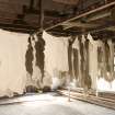 Interior. Main Building, 4th floor/Top Flat. Goat skins hanging from tenter hooks.